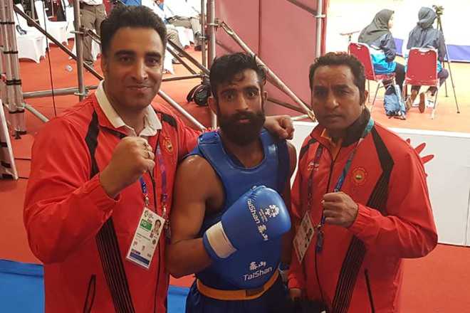 Wushu player Surya Bhanu Pratap Singh (centre) in Indonesia