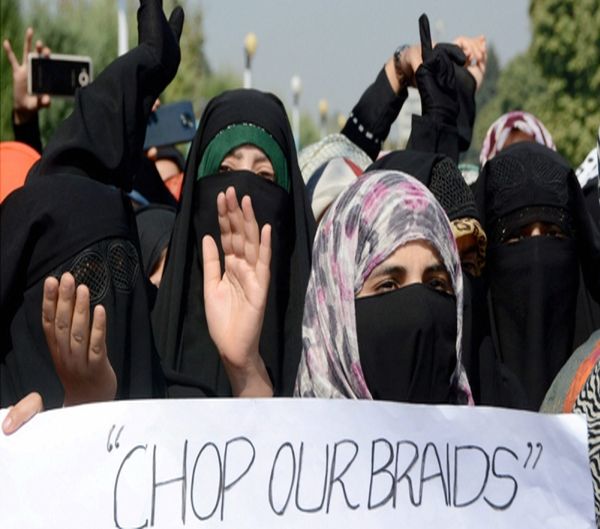 women protesting against alleged braid chopping incidents