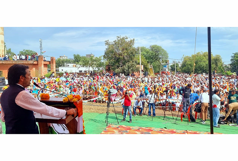 AICC gen secy G A Mir addressing a large public rally at Khour