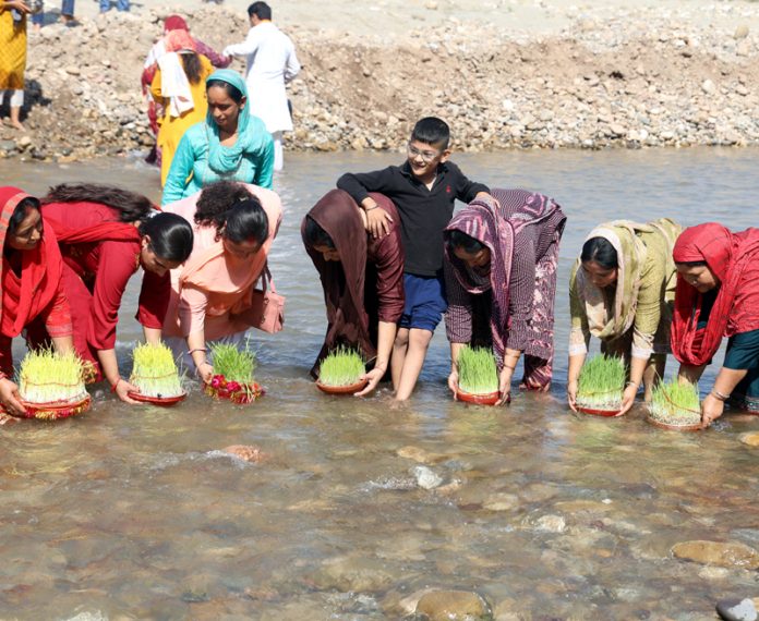 Devotee immersing Sakh in river as 9-day long Navratra festival culminated in Jammu