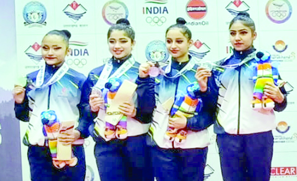 J&K Rhythmic Gymnastics team posing with their silver medals at the 38th National Games in Dehradun.