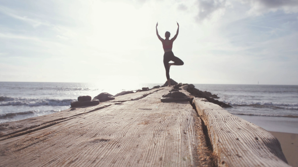 Woman doing yoga post cliff